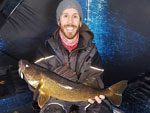 Bay of Quinte Walleye from ice fishing Matthew Randall holding a large walleye on a frozen Bay of Quinte.